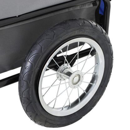 Close-up of a black tire with a white rim on a vehicle.