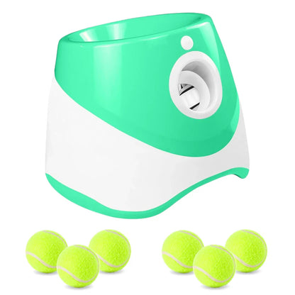 Green and white ball launcher with tennis balls on a white background