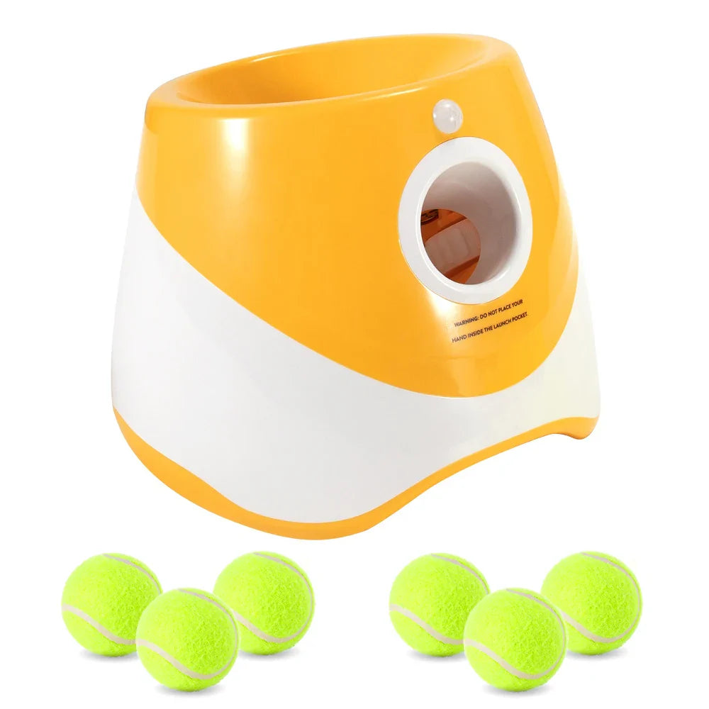 Yellow and white tennis ball launcher with multiple tennis balls on a white background