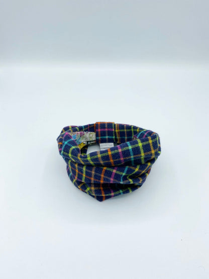 Plaid patterned fabric tube on a white background