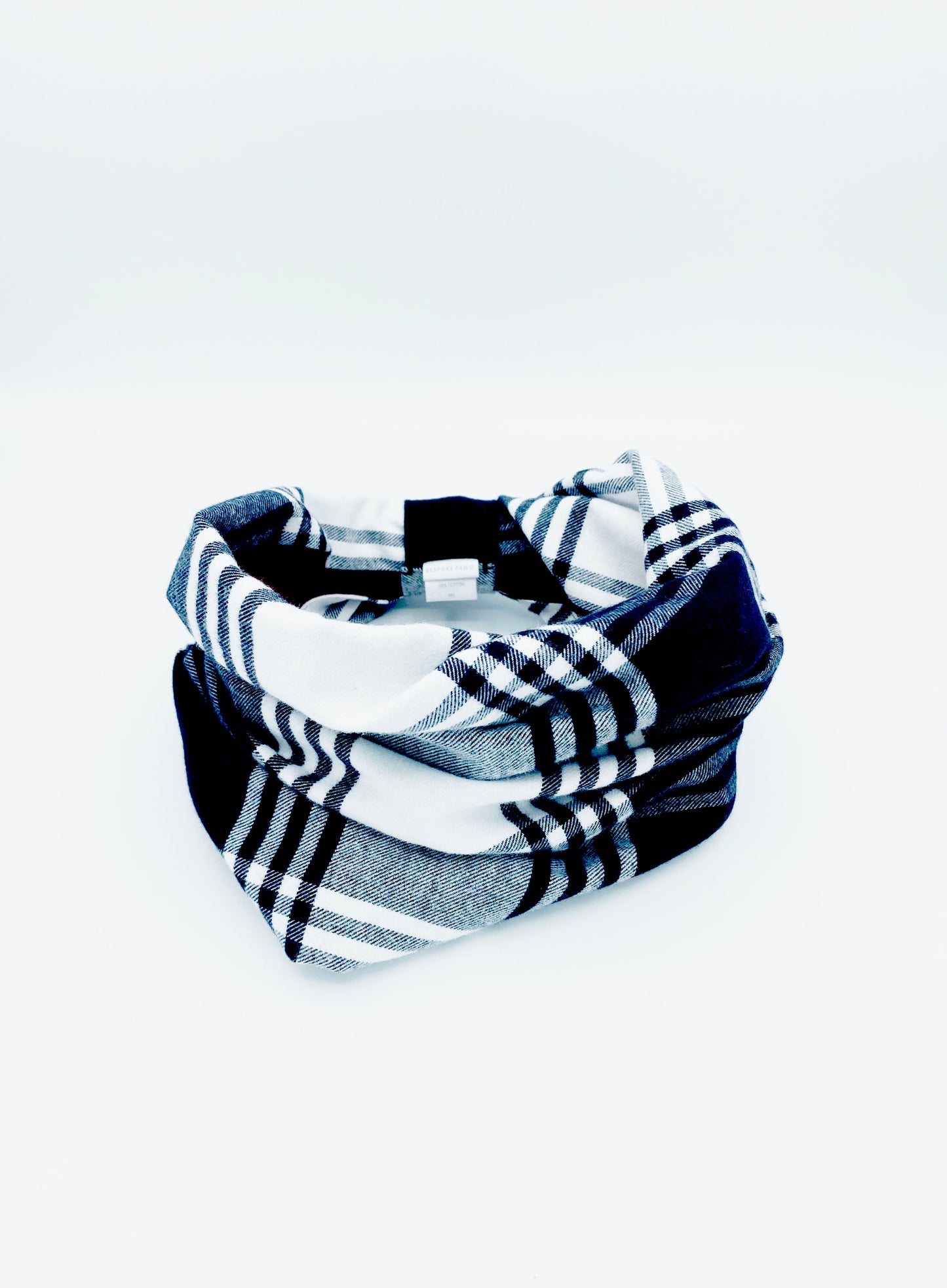 Plaid patterned headband on a white background