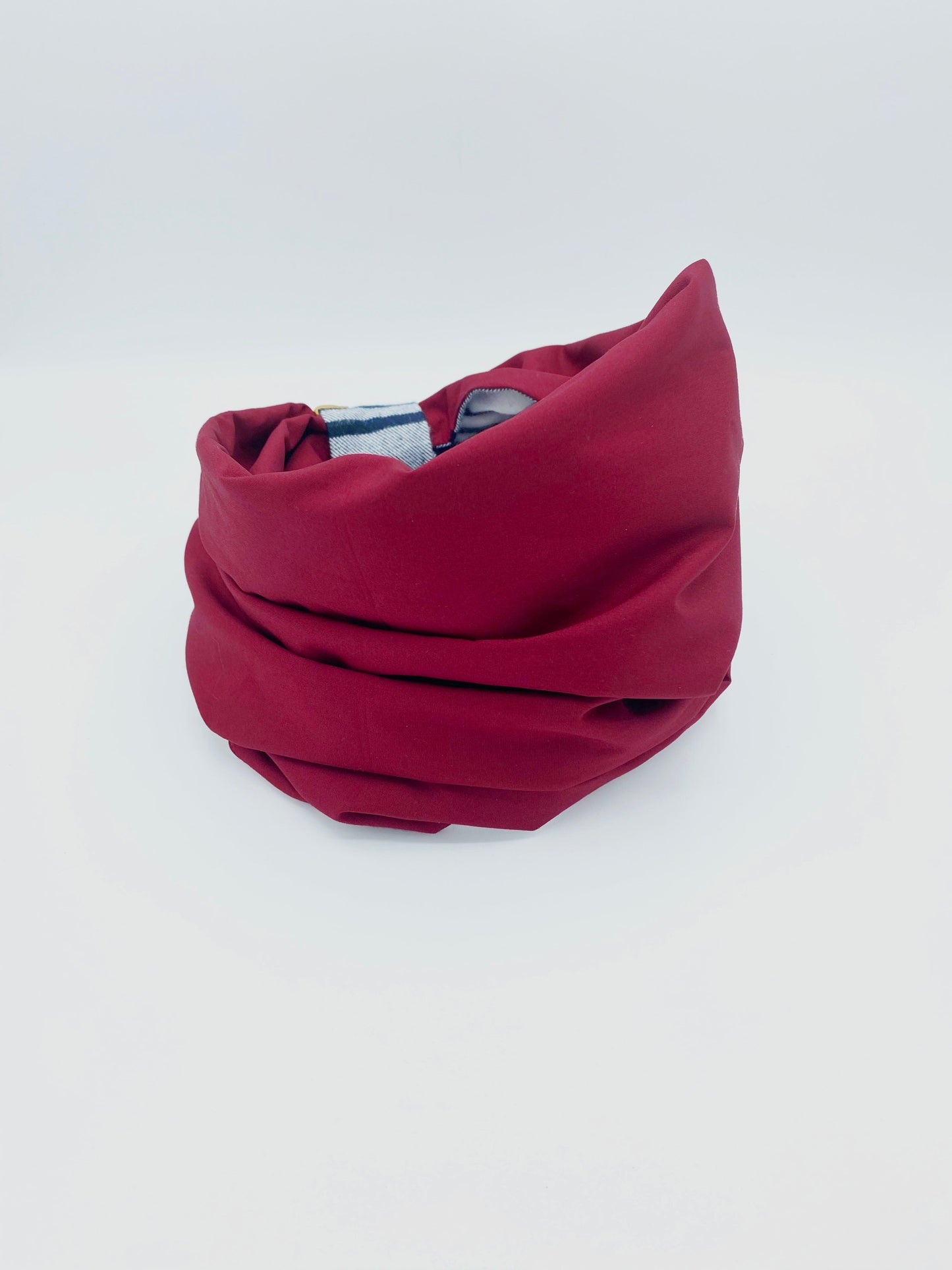 Red fabric roll on a white background