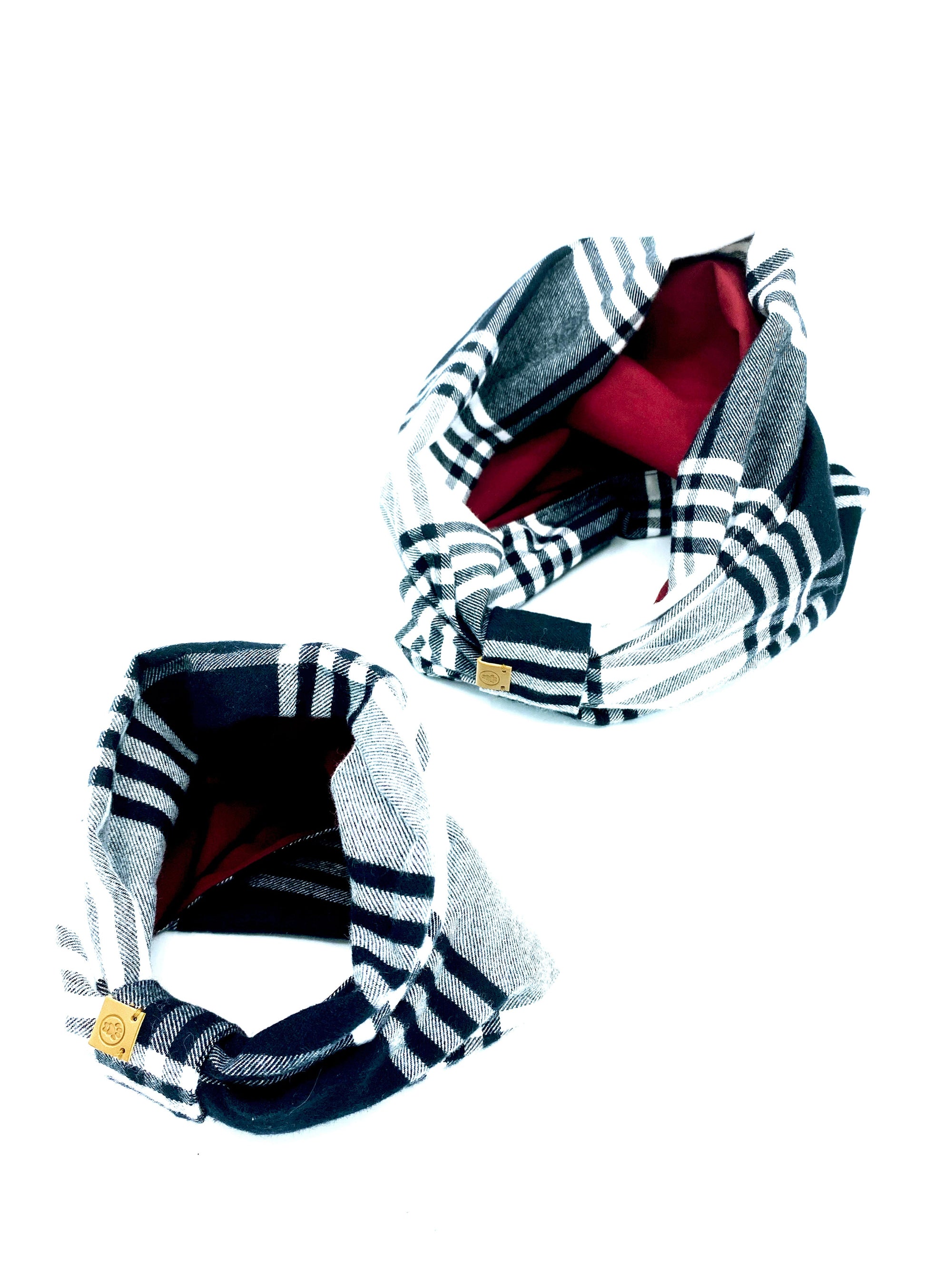 Two plaid headbands with red and black accents on a white background