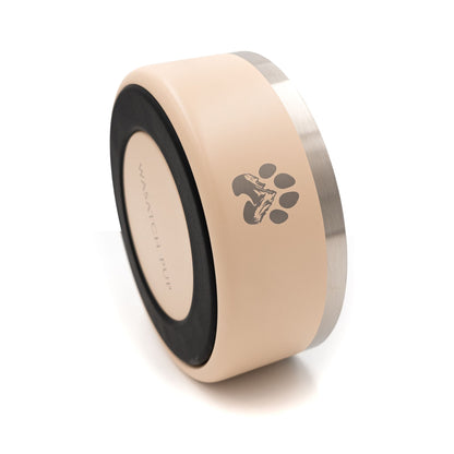 Beige and black cylindrical product with paw print design on a white background