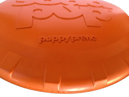 Orange dog toy with 'Puppy Pride' branding on a white background