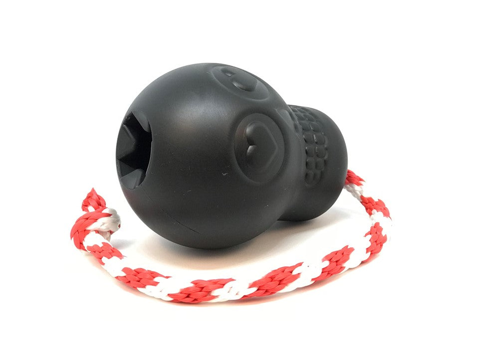 Black ball with a red and white rope on a white background