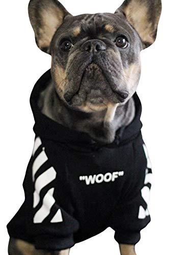Dog wearing a black hoodie with white patterns and 'WOOF' text on a white background