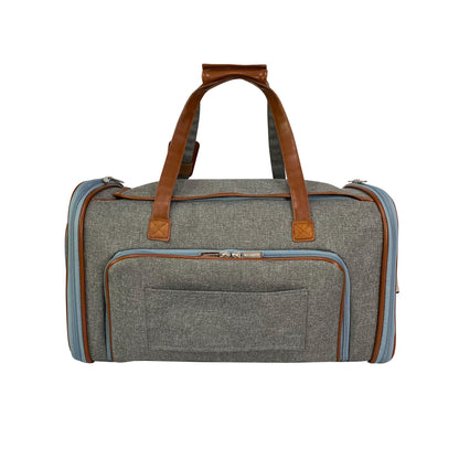 Gray duffel bag with brown leather straps on a white background