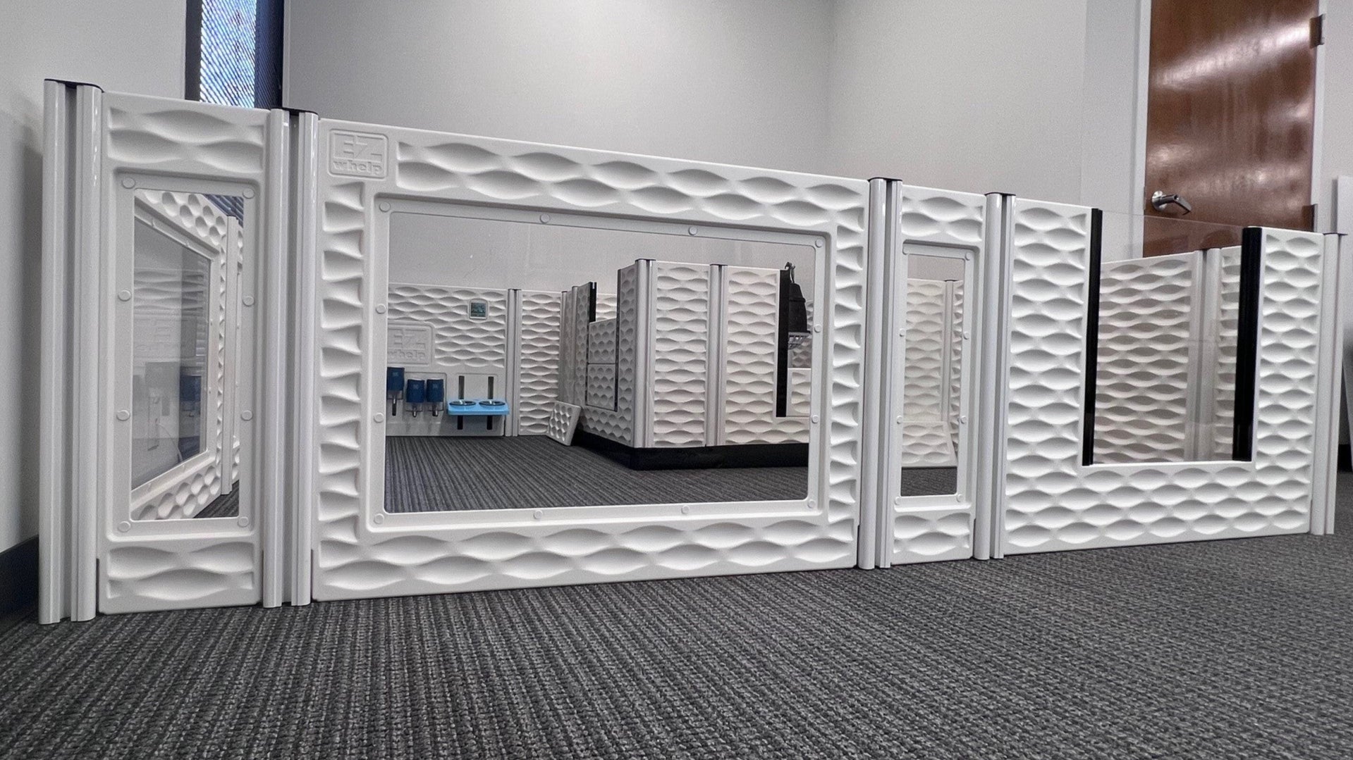 White textured wall panels with mirror in a room setting