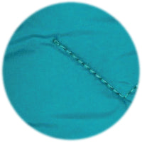 Close-up of a teal fabric with visible stitching