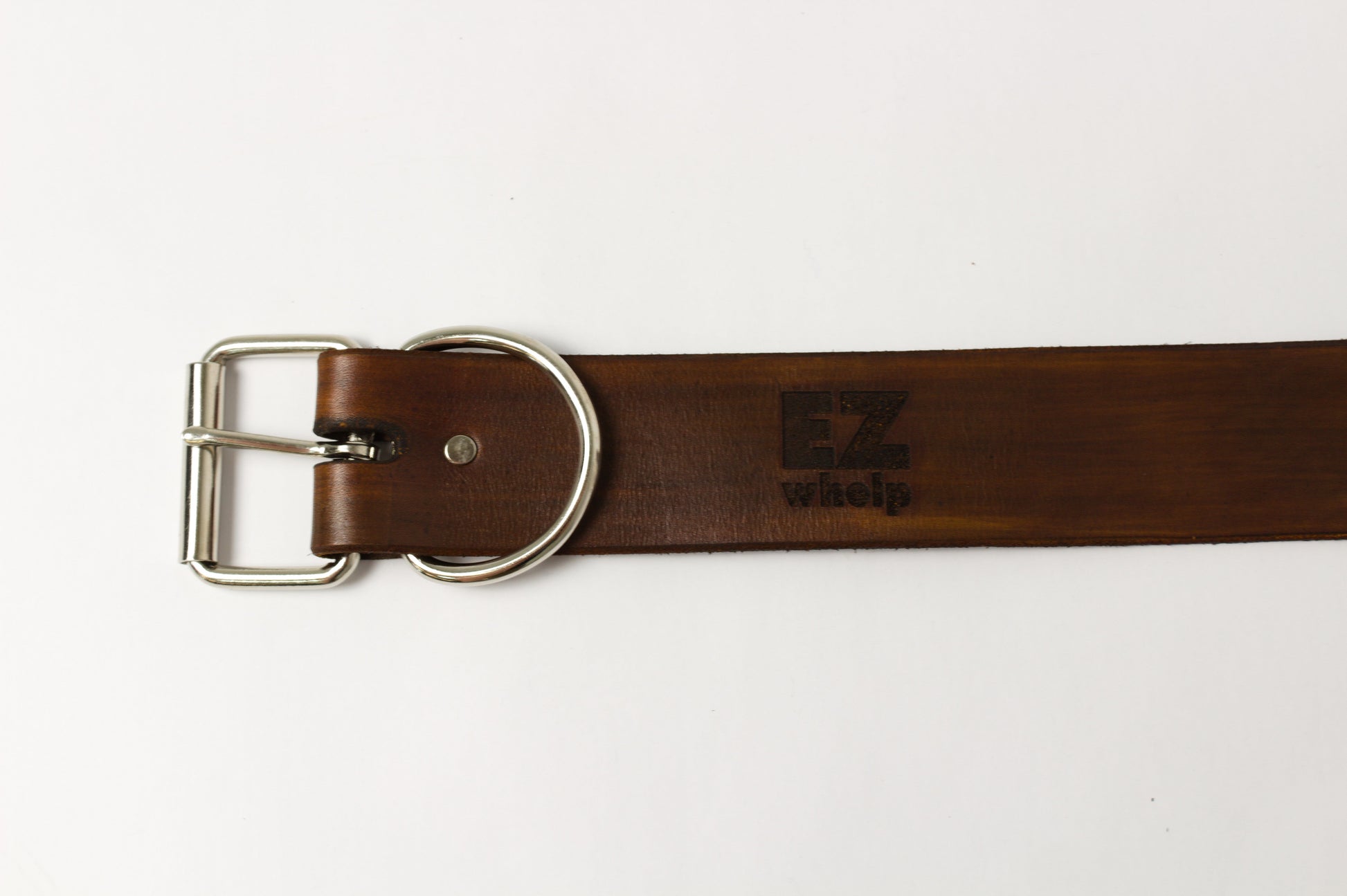 Brown leather belt with silver buckle on a white background