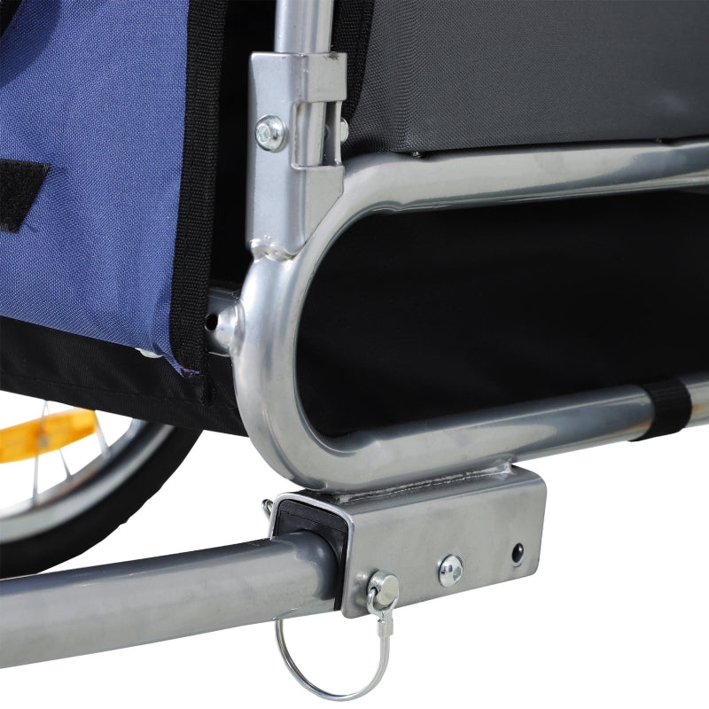 Close-up of a wheelchair with a blue bag attached to the backrest.