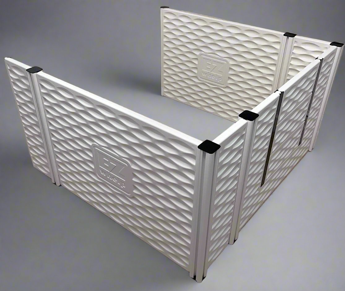 White pet playpen with textured surface and visible brand logo on a gray background