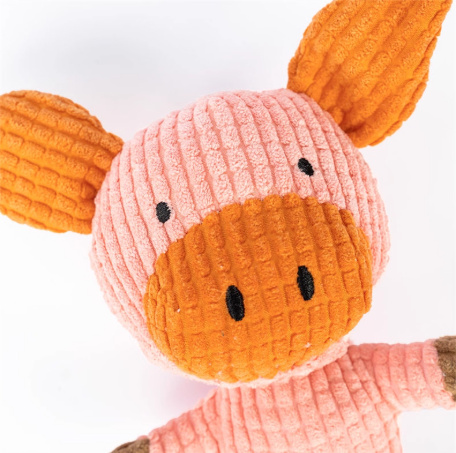 Close-up of a pink and orange plush toy with a white background