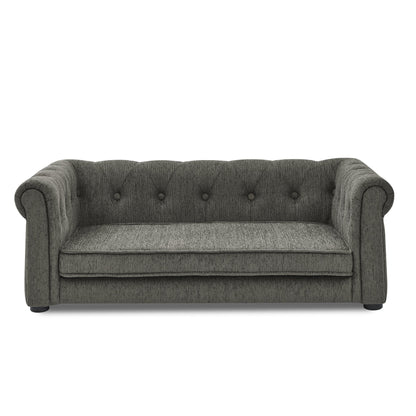 Gray sofa with tufted backrest on a white background
