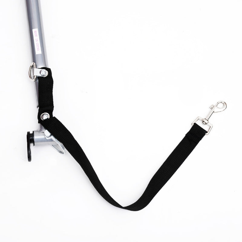 Black strap with metal attachments on a white background