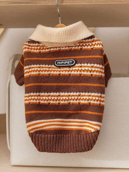 Striped dog sweater with 'HIPIPET' label on a hanger