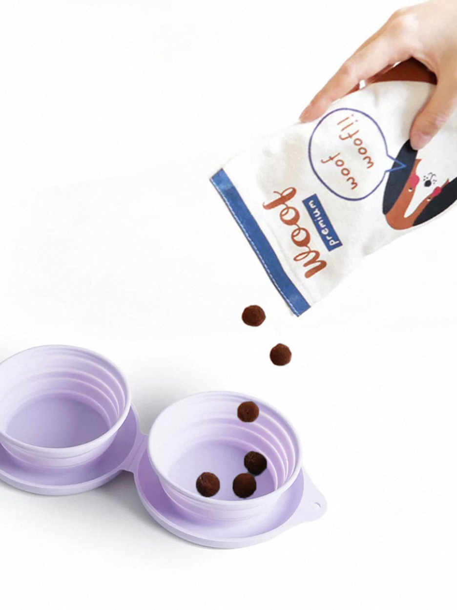 Collapsible purple pet water bowl with a hand pouring treats from a branded bag.