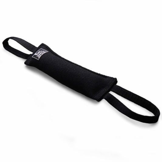 Black dog toy with a strap on a white background