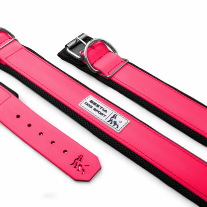 Pink dog collar and leash set with a visible brand logo on a white background