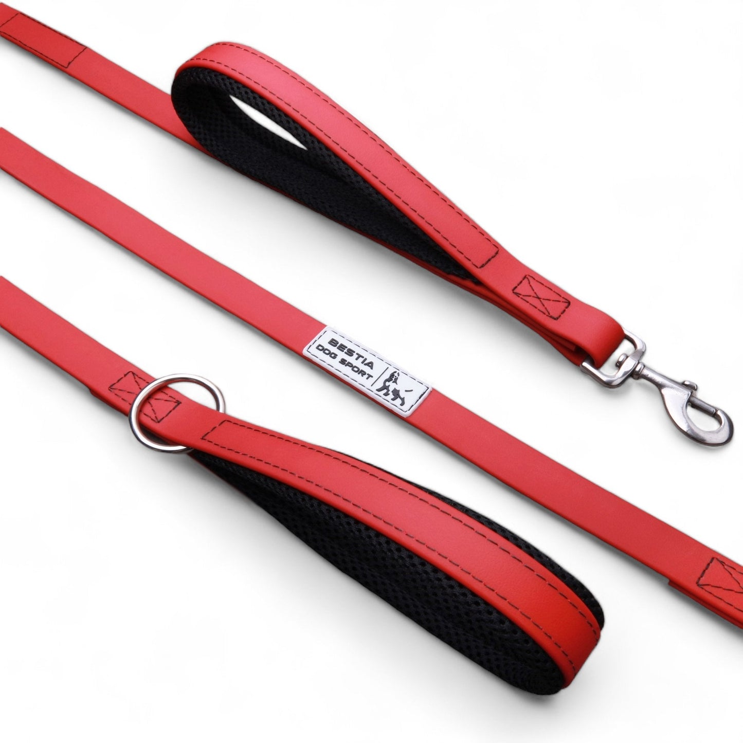 Red dog leash with black handle on a white background