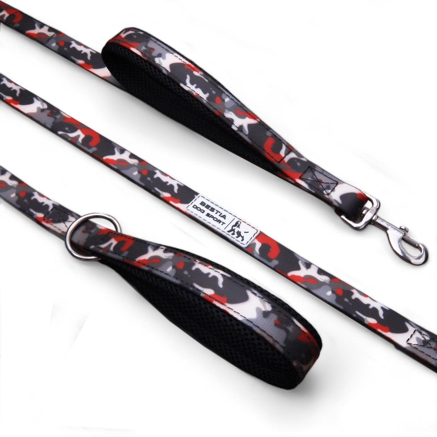 Dog leash with black handle and red and white pattern on a white background