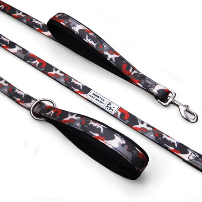 Dog leash with black handle and red and white pattern on a white background