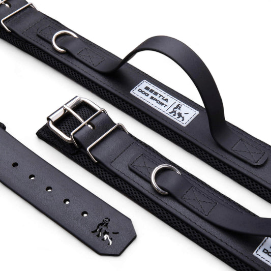 Black dog collar with metal buckle and visible brand logo on a white background