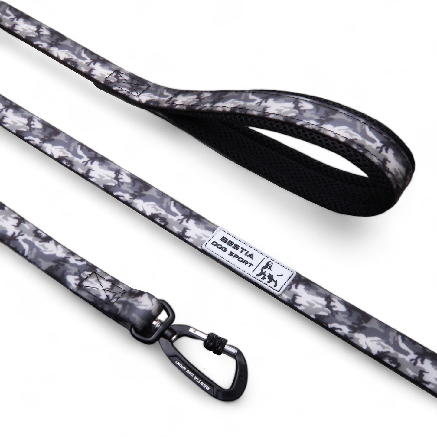 Dog leash with camouflage pattern and brand label on a white background