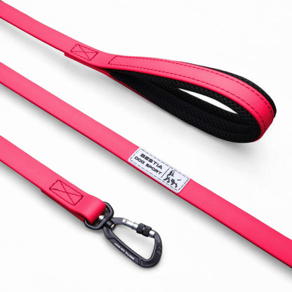 Red dog leash with black clip on a white background