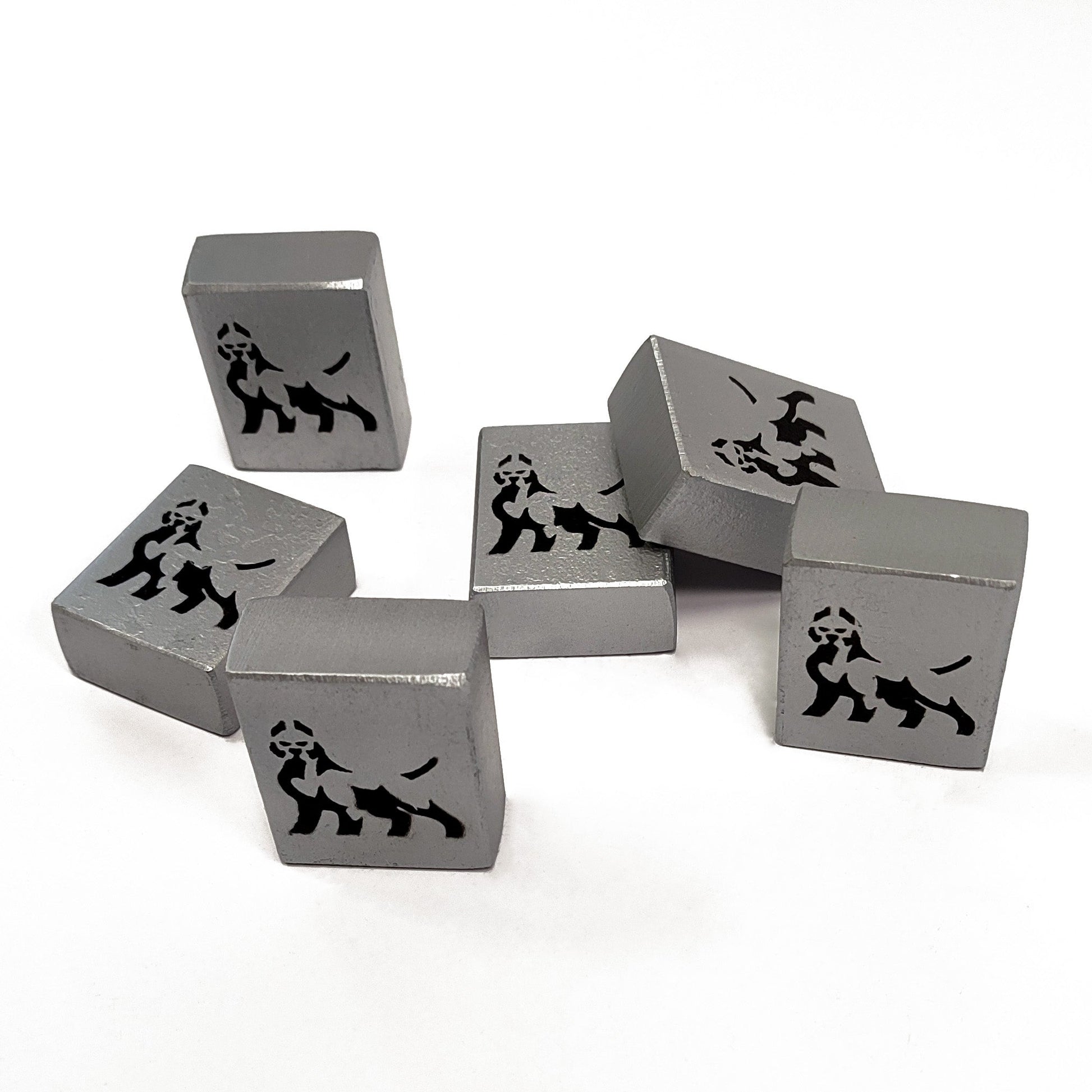 Silver dice cubes with lion engravings on a white background