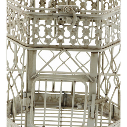 Decorative white metal birdcage with intricate lattice work on a white background