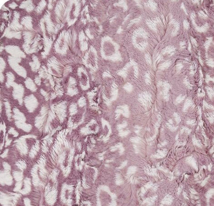 Close-up of a textured pink fabric with a subtle pattern