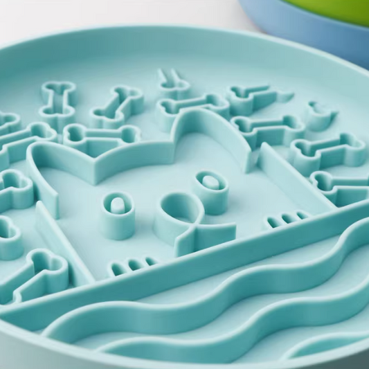Close-up of a blue silicone mold with various shapes on a white background