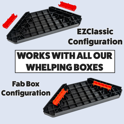 Two black plastic trays with red connectors on a light blue background, featuring text about compatibility with whelping boxes.