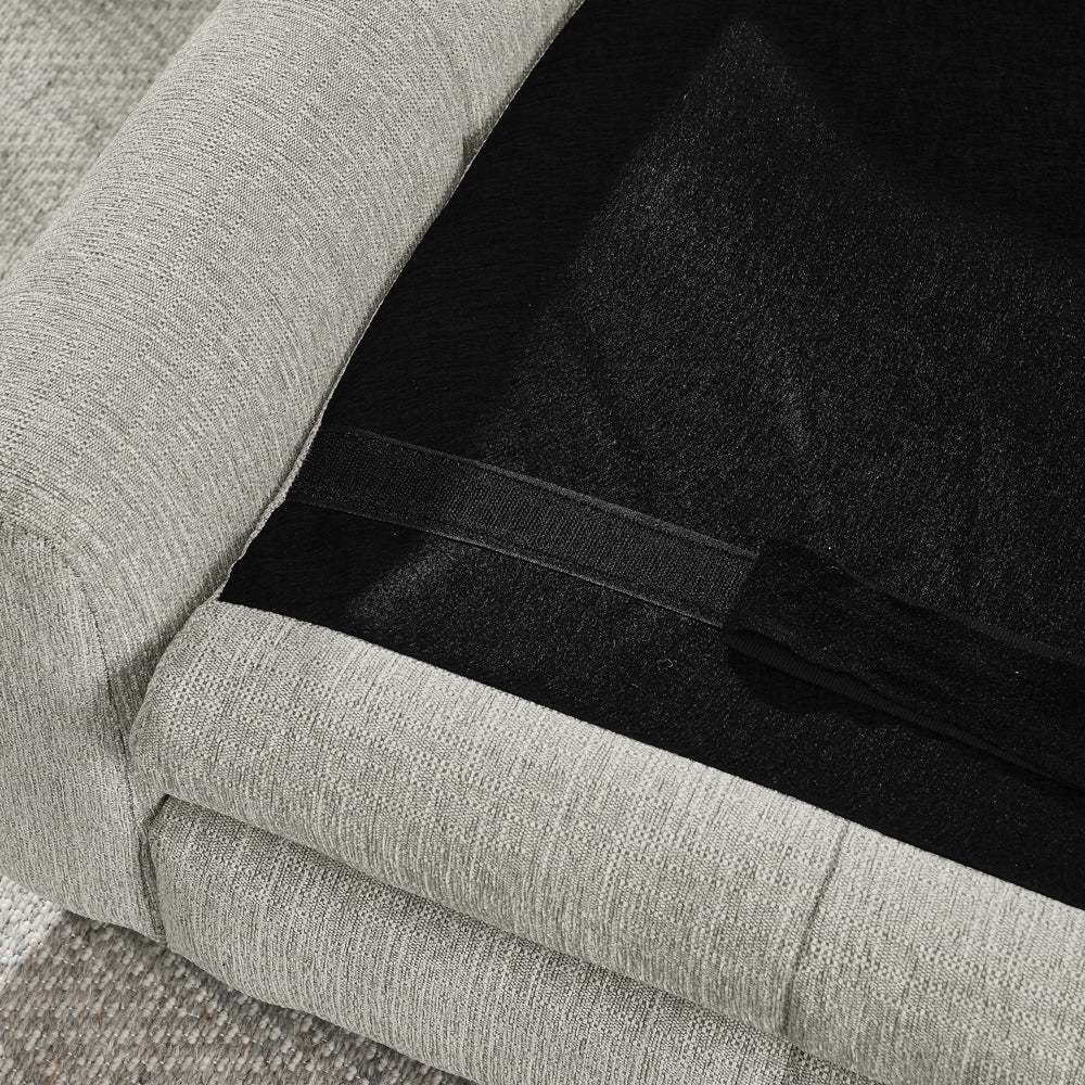 Gray upholstered chair with a black cushioned seat