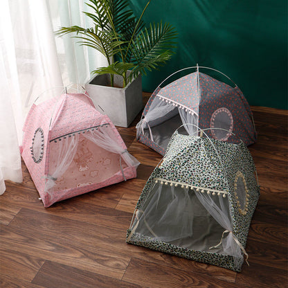 Three pet tents with decorative canopies on a wooden floor.