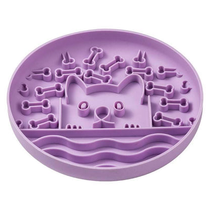 Purple silicone mold with bone-shaped cavities on a white background