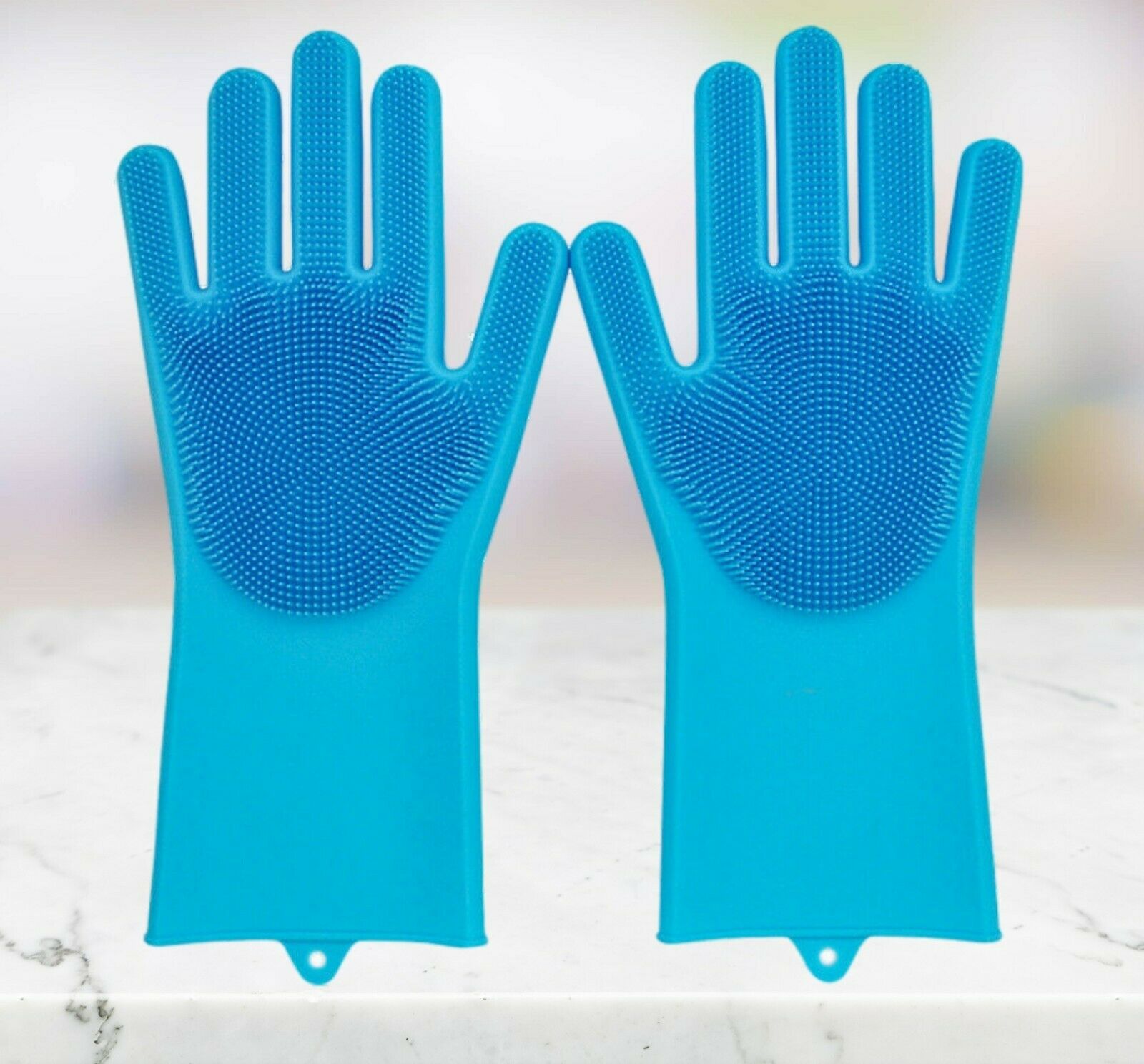 Pair of blue silicone gloves on a light background