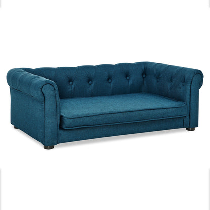 Blue tufted sofa on a white background