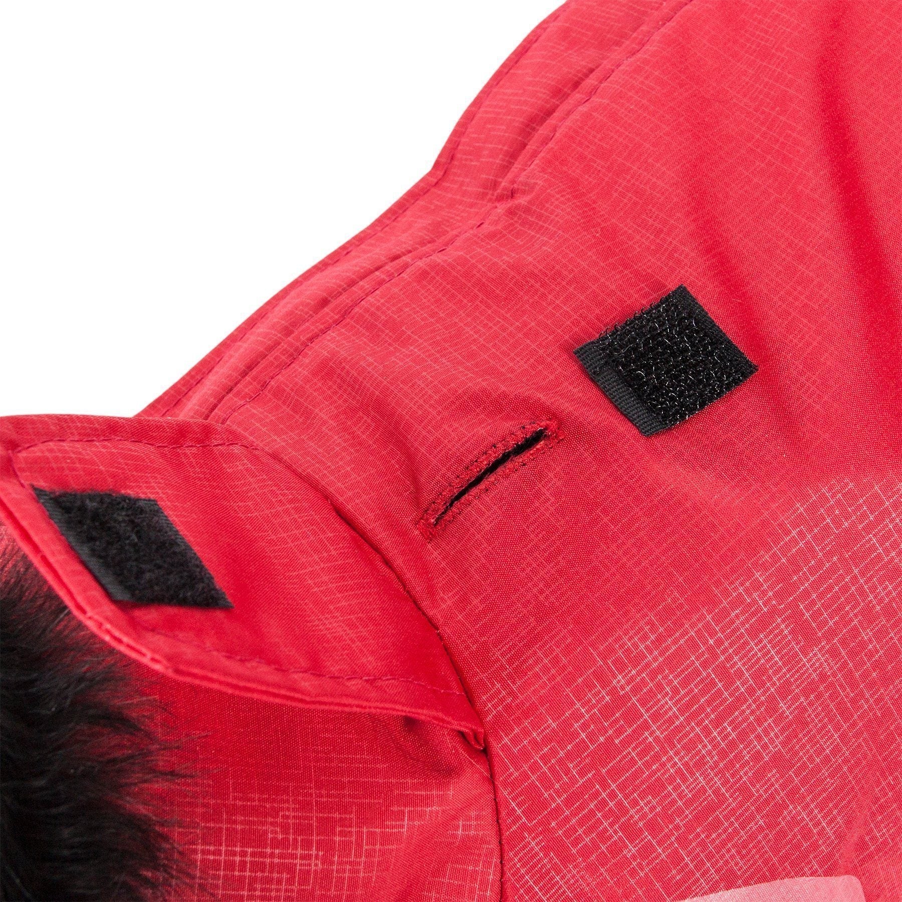 Close-up of a red jacket with a black patch on a white background