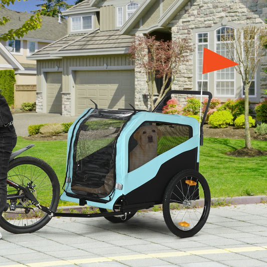 Bicycle trailer with a dog attached, parked on a sidewalk in a residential area.