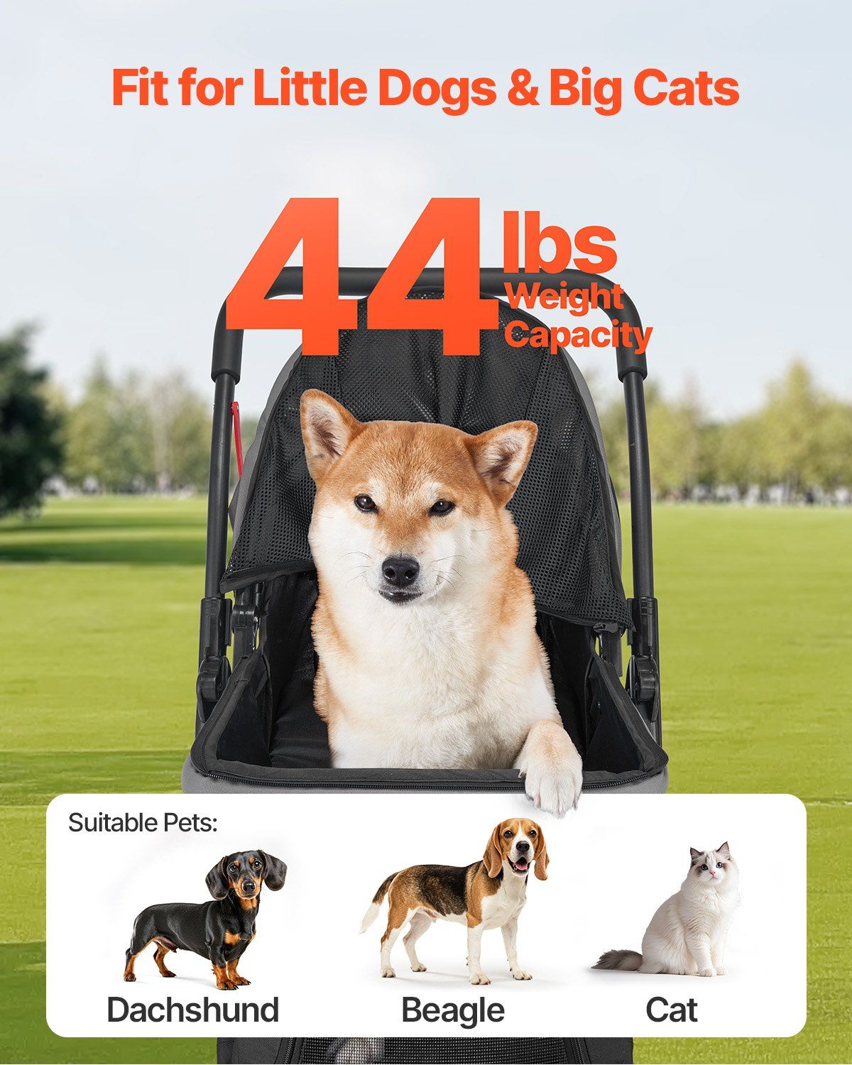 Pet stroller with a dog inside, suitable for small to medium-sized pets, on a grassy field.