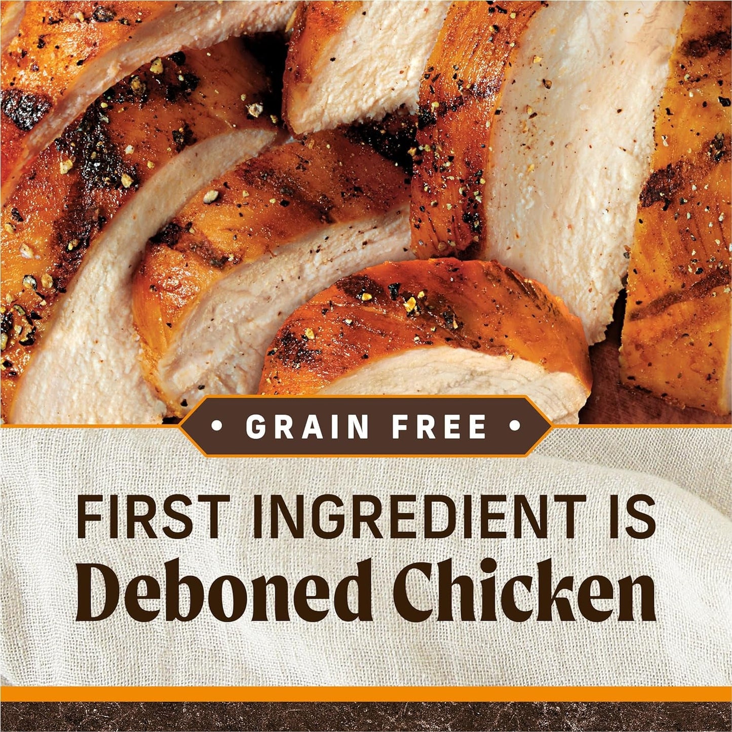 Grilled chicken with 'Grain Free' and 'First Ingredient is Deboned Chicken' text on a textured background