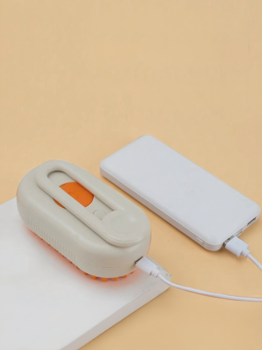 Small electronic device with a power bank on a beige background