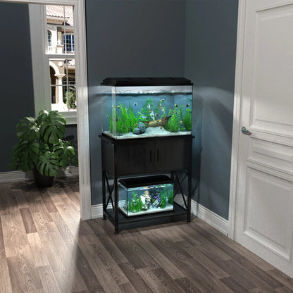 Two aquariums on stands in a room with a plant and window.