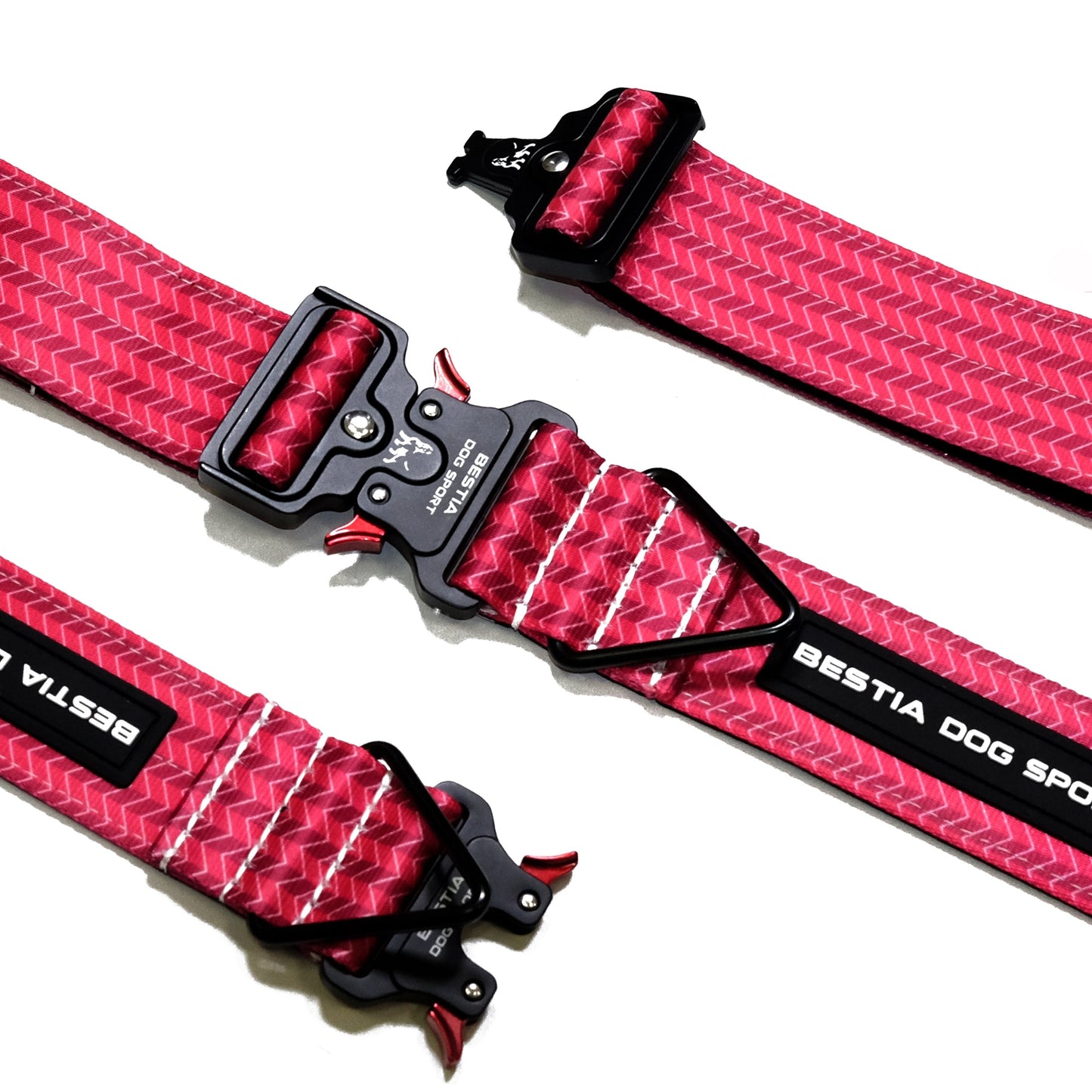 Red and black dog collar with visible branding on a white background