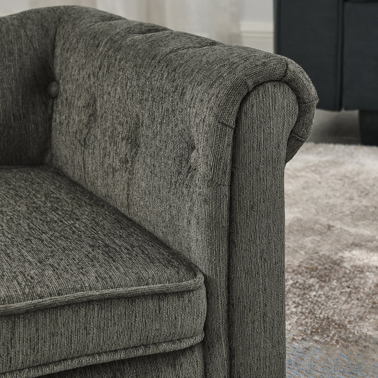 Gray textured sofa with a blurred background