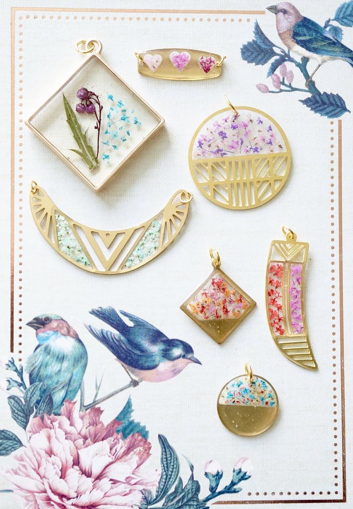 Collection of decorative items including jewelry and trinkets on a floral background