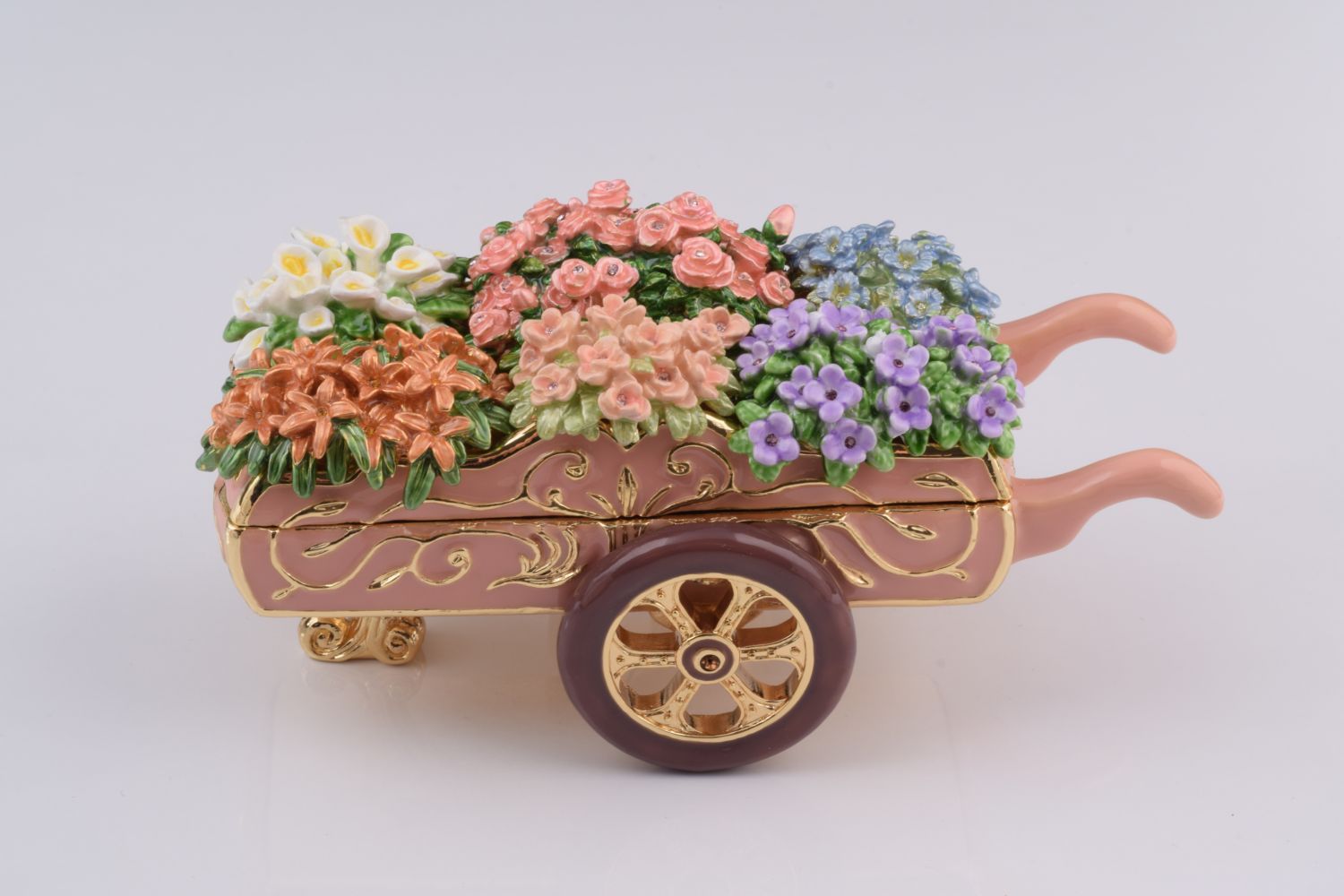 Decorative toy cart with colorful flowers on a white background